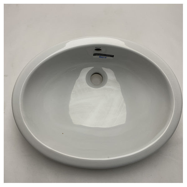 Овальний керамічний умивальник De Roca 276657 NEO - міцна та вологостійка раковина морського класу для компактних приміщень